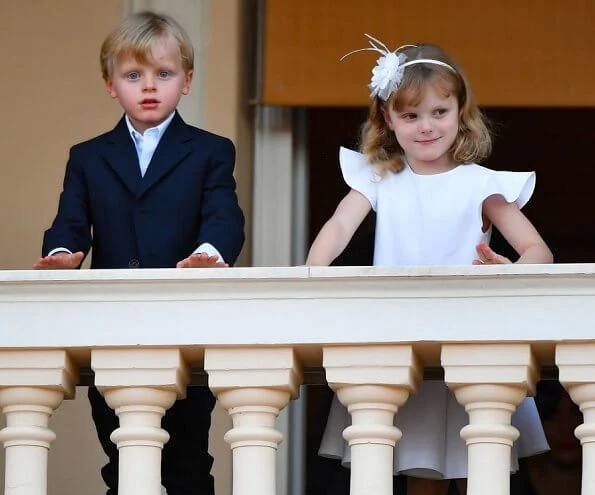 Hereditary Prince Jacques and Princess Gabriella. Princess Charlene wore a new Brunello Cucinelli v-neck midi dress. Louis Vuitton dress