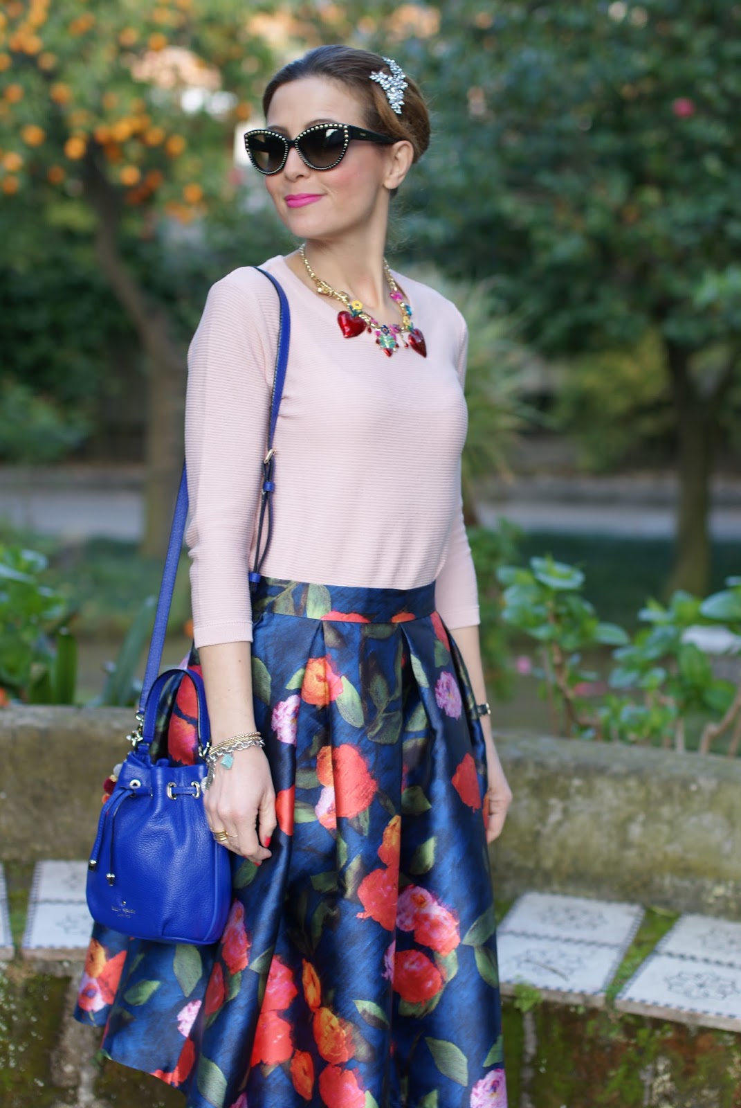 How to wear a midi skirt in Spring: floral midi skirt, tweed ankle boots, jeweled hair pin on Fashion and Cookies fashion blog, fashion blogger style