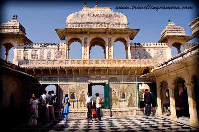   I visited Udaipur with family a few years back. It was part of a larger itinerary that started with Jaipur, Ajmer, Pushkar, Chittorgarh, and Udaipur. Udaipur was the last stop and a perfect culmination to our trip.  I had booked two lake-view rooms in the Hanuman Ghat Area, which had a very Paharganj-like feel to it. I remember one funny incident. My family is used to having rusks with the morning tea, so I along with my cousins, went out to buy them. I kept asking the shopkeeper for rusks, and he kept showing me various types of juices. Then I spotted a packet of rusks and pointed at it. At this he laughed and said "oh toasts?" So now I know if I need rusks in Rajasthan, what I should ask for.       Anyway, coming back to Udaipur, it is a multilayered experience. Pretty, crowded, historical, modern, culturally-rich, actually it is a perfect slice of Rajasthan and in particular Mewar. Add to it some spices of its own that make it unique, and you have Udaipur, one of the most interesting cities in India.       Best time to Visit: Because the rest of the year can be so hot here in Rajasthan, Winter is the best time to visit most parts of the state. This is also the time when most of the festivals are held and when the streets are most lively with tourists. This is also the time when the stay options are likely to be most expensive, so book in advance. And don't forget to carry woollens as the nights can be chilly.       How to get there: Let's first talk about how to get here. We took a hired a Toyota Qualis from Pushkar to Udaipur, via Chittorgarh, Eklingji, Nathdwara, and Haldighati. Seeing Haldighati had been a long-time dream of my father. It was so gratifying to see him relishing the drive through the yellow hills so much. He had also always wanted to see Chittorgarh, and was simply delighted to be there. I will talk about Chittorgarh in another post in details.       By Road - You could either do what we did, as detailed above. Or you could plan a drive from Delhi or Mumbai, stopping en route for one night, if only one of you is driving. Or simply book yourself a comfortable night bus.       By Train - If you are travelling in from Delhi and looking for luxury and hospitality on train, you can book your place on the Palace on Wheels. That can be an experience in itself. Or you can book a train from any major city in India. Udaipur is well connected to Delhi, Mumbai, Kolkata.       By Air - The closest airport to Udaipur is the Maharana Pratap Airport, which is about 22 kilometers from the city. One can board flights from all major cities in India. Once you land, a taxi should be easy to book.       Where to Stay: There are several 5-star hotels where you can stay if you are willing to spend a fortune - The Oberai Udai Vilas, the Taj Palace, and the Leela Palace are just some of them. However, you can also opt for other good hotels that offer decent lake-facing rooms and are pocket-friendly too. We opted for such an option, and were pretty satisfied too.       Good accommodation is available starting from a few 100 Rs to whatever you want to spend on your stay. The best location is around Lake Pichola and you can find backpacker friendly accommodations such as dormitories too. Or if you are looking at a more culturally rich experience, you could opt for one of the Havelis converted to a hotel.        What to Eat: Typical Rajasthani food can be spicy, so be watchful of your tolerance and experiment accordingly. If you are in Udaipur, definitely try the traditional Rajasthani Thali. If you are non-vegetarian, you must taste Laal Maas as well. Gatta Curry and Daal Baati Choorma are Rajasthani specialties that one must try. Daal Baati Choorma can be heavy, so plan accordingly. Pyaaz Kachori, Samosas, and Jalebis are popular street foods in Udaipur.        What to See: The city of Udaipur is also known as the "City of Lakes" because of several large lakes inside and around the city. It also has several historical buildings, palaces and temples that you can visit. Here are some of the most popular places that you can plan during your trip:      The City Palace: The City Palace at Udaipur was built by Maharana Udai Mirza Singh in the 16th Century. It is perhaps the largest such palace in the whole of Rajasthan. Maharana Udai Mirza Singh is said to have got this built because he was instructed by a sage to do so at this very location. The palace is located on the banks of lake Pichola very near the Jagdish palace and can also be seen from the Monsoon Palace on the hill top. The Palace represents a fusion of the Rajasthani and Mughal style of construction and has been used as a location for various films. For example, the song "Ghunghat ki aad se..." from "Hum hain rahi pyaar ke" was shot in one of the courtyards of this palace. The lawns of the palace are now leased out for parties.      The Monsoon Palace: Also named as the Sajjan Garh Palace after Maharana Sajjan Singh, the Monsoon Palace was built on a hilltop to provide a view of the Monsoon clouds. I am not sure how much it is used for that purpose now, but it definitely provides a panoramic view of the Udaipur City. The drive to the palace is pleasant through a wild-life sanctuary, which is a reserve for reptiles, tigers, nilgai, sambhar, wild boars, hyenas, panthers, and jackals. And, as expected, we did not see any of those during the ride. The Monsoon Palace is also the Sunset Point. When we visited, a quite crowd was waiting for the sun to set with their cameras ready on the Tripods. It was a peaceful, safe, and beautiful place.      Lake Pichola: This is a man-made lake in the city and was created in the 15th century, then extended by Maharana Udai Singh II in the 16th century. This is really the most famous lake in the city. The various islands in the lake are home to more tourist attractions and around the lake are some of the most famous ghats and temples, and also accommodation options. So in a way, this is actually the center of the city. You can also go for a boat ride. If you want to see Jag Mandir then you anyway need to.       Jag Mandir / Jag Niwas: Jag Mandir and Jag Niwas were built in the 16th century on two separate natural islands in Lake Pichola. Jag Niwas has now been converted to the luxury hotel Lake Palace and is a luxury property owned by Taj hotels. It is said that Jag Mandir (or Lake Garden Palace) was the original inspiration behind Taj Mahal. Prince Khurram, who would later come to be known as Emperor Shahjahan, was inspired by this building when he was growing up.       Vintage Car Museum: Collecting vintage cars is a popular hobbies of the Maharajas of Rajasthan. This Vintage Car Museum is popular with car enthusiasts and is known for housing some really beautiful cars. The ticket for adults is Rs 250 per person.       Saheliyon ki Bari: This is a garden that Sangram Singh II gifted to his queen. It has beautiful lawns, fountains and Statues. However, after seeing City Palace, Monsoon Palace, this can be quite underwhelming. If short on time, you can skip visiting this place.         Jagdish Temple: The temple is located near the main market and you will almost certainly run into it if you happen to be in the city. The temple can be visited not only for the purposes of offering prayers but also for great architecture and carvings.       Places to Visit Around Udaipur: If you have some time, I would say that the following places can be explored:      Eklingji Temple: I remember reaching here early in the morning at around 9 and we had to wait for the temple complex to be opened to visitors. The temple opens very early at 4, but closes again at 7. It reopens then at 10. So we had to wait for an hour. But the wait was worth it. Apart from the main temple that has the statue of four-faced Shiva, there are several smaller temples and other structures in the complex. The architecture is marvelous. However, the tour is tightly regimented and photography is not allowed. So if you are going there for photography, then you need to rethink. The temple is about 40 kms from Udaipur.       Nathdwara (Shrinathji) Temple: We reached here one day before Holi and this being a temple dedicated to Lord Krishna, the atmosphere here was electric. There was color everywhere and if you happen to be a devotee, the sight might move you. It was difficult to get in, and the temple complex was unbelievably crowded. Crowds scare me, so I wanted to exit the scene as soon as possible, but for religious people, this is a must-visit. This is about an hour away from Udaipur and can be covered along with Eklingji.       Chittorgarh Fort via Haldighati: This can be a day-long excursion from Udaipur. The Fort is about 120 kms from Udaipur. You can also visit Haldighati along with this. This deserves a post of its own, so you will soon see it. The fort is simply beautiful, and must-visit in my opinion.     Kumbhalgarh Fort: I haven't been here, but have heard a lot about it. It is closer to Udaipur than Chittorgarh. I guess, with Chittorgarh, we have that added factor of legends that are associated with it, such as that of Rani Padmavati, so that adds to its charm. But Kumbhalgarh as well is very beautiful apparently.           I have personally experienced most of the aspects covered in this story, except a few where I have mentioned this explicitly. However, this was a few years back and things may have changed since then. So in case there are any corrections or additions, please do leave a comment here, and I would correct / include. 