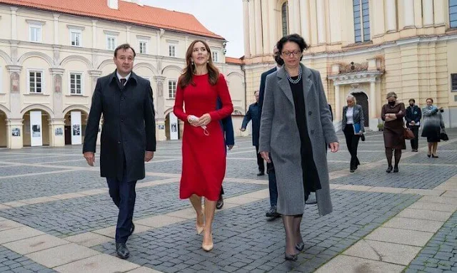 Crown Princess Mary a red contrast-stitch cady dress from Dolce & Gabbana, and double cashmere oslo coat from Joseph