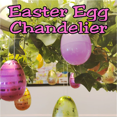Take your Easter Egg hunt inside with this fun Easter decoration. It's so easy to decorate your dinning room chandelier with beautiful Easter eggs and greenery to make a stunning Easter Egg Chandelier that will bring some extra sparkle and shine to your Easter dinner. #easter #easterdecoration #diy #chandelier #diypartymomblog