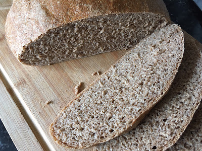 Slices of bread showing a more risen shape and open crumb