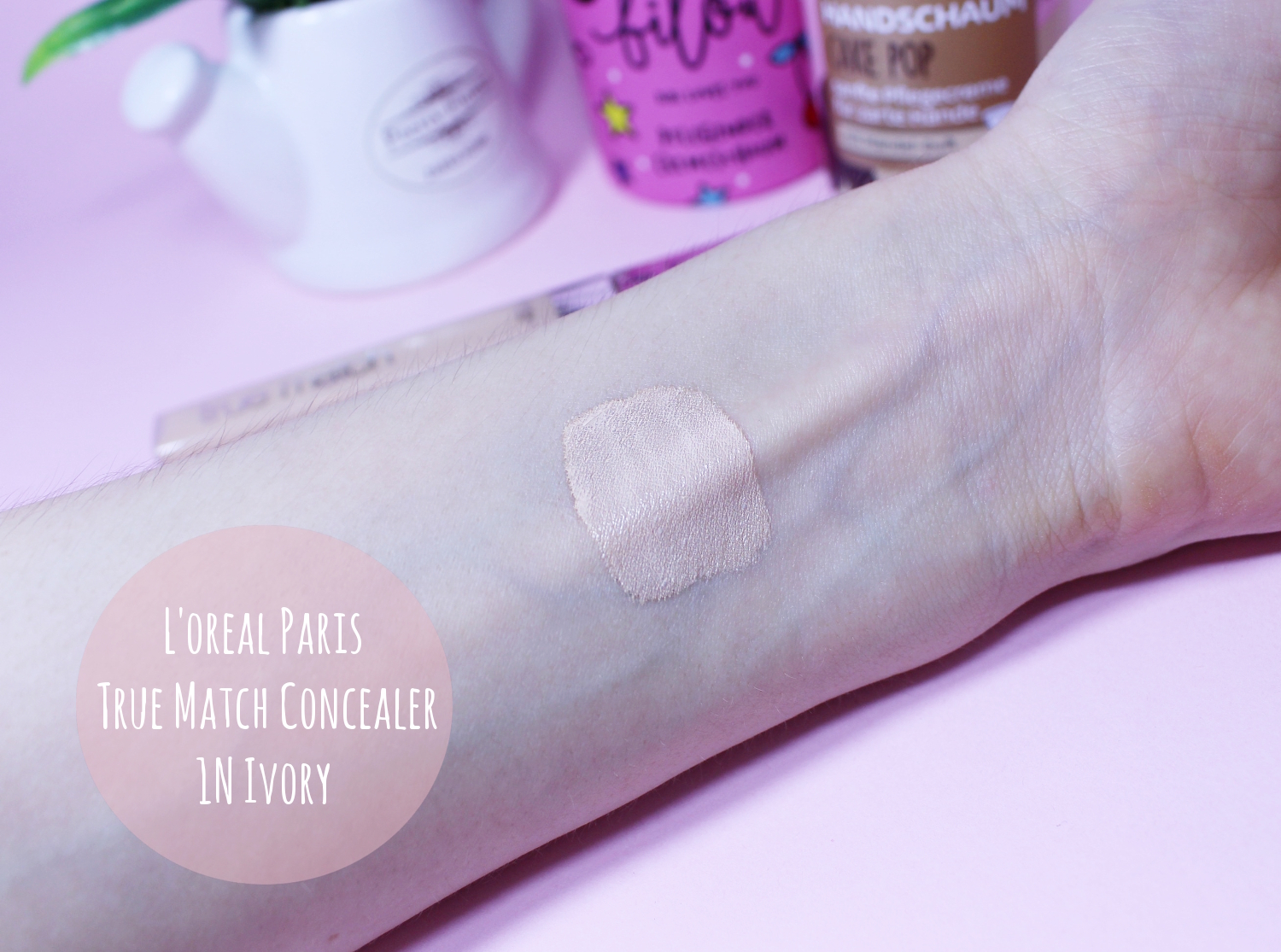 close-up swatch on a light skin of loreal true match concealer