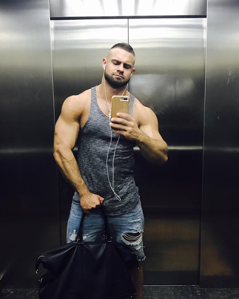strong-gay-guys-wide-shoulders-elevator-selfie