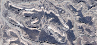 Allegory in dark blue stone relief birth of Constellation, galaxy, nebula, fossilized photography abstract landscapes of deserts of Africa from the air, collection of Abstract Naturalism Munimara Allegory in dark blue stone relief birth of Constellation, galaxy, nebula, fossilized photography abstract landscapes of deserts of Africa from the air,