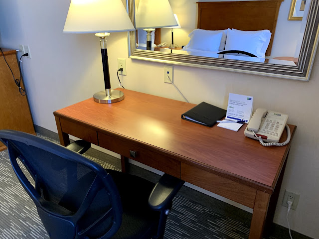 a desk with a phone and a telephone on it