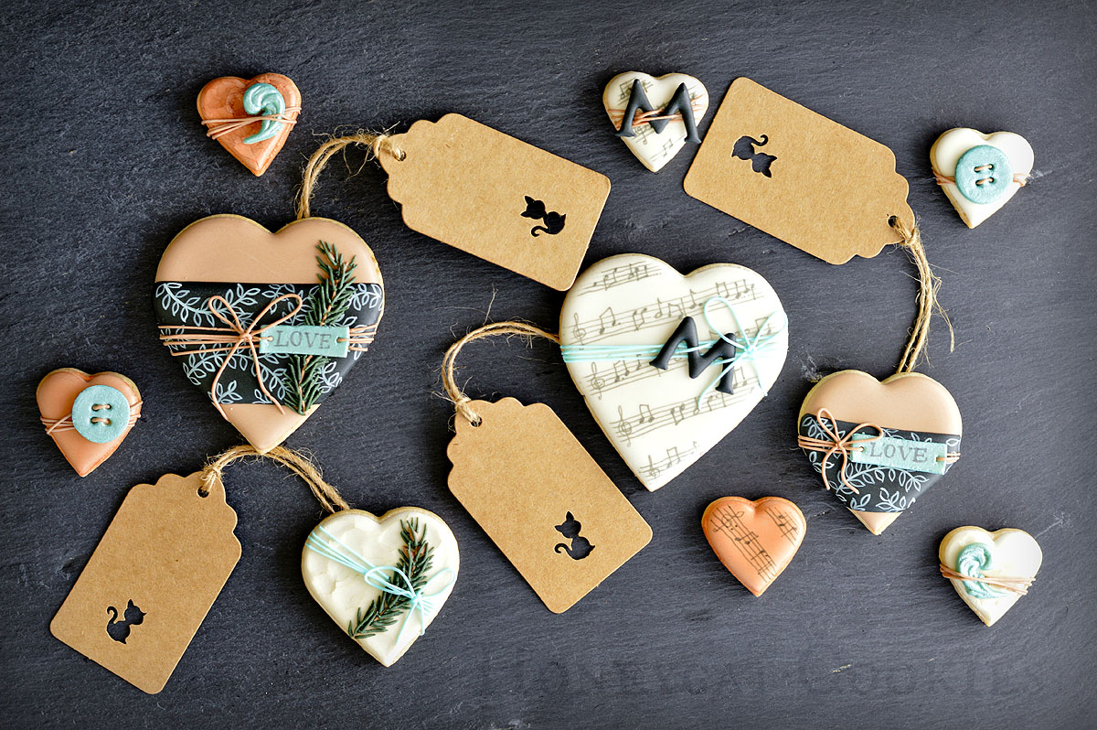 Valentine's Day decorated cookies for a man, displayed with Honeycat Cookies gift tags