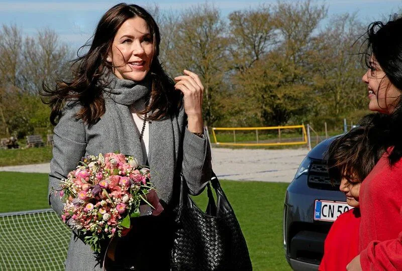 Crown Princess Mary wore a new checked wool-blend blazer, trousers suit from Alexander McQueen. Prince of Wales. Bottega Veneta