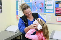 school nurse helping a student