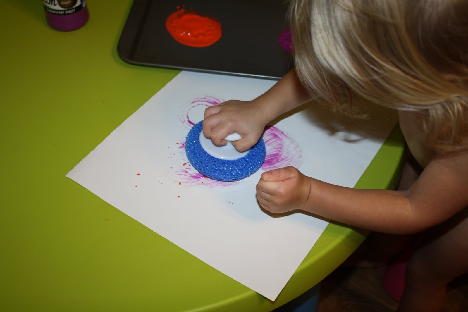 Stamping with the scrub brush made "cookies" according to Kenna. She