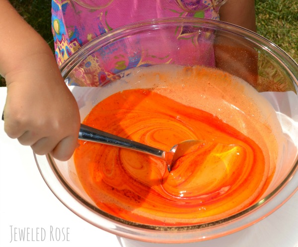 DIY Pumpkin SLIME- so fun for kids to stretch, pull, & squish! My kids couldn't stop giggling!