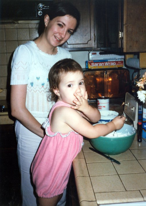 mother and child baking together with vintage pyrex mixing bowl