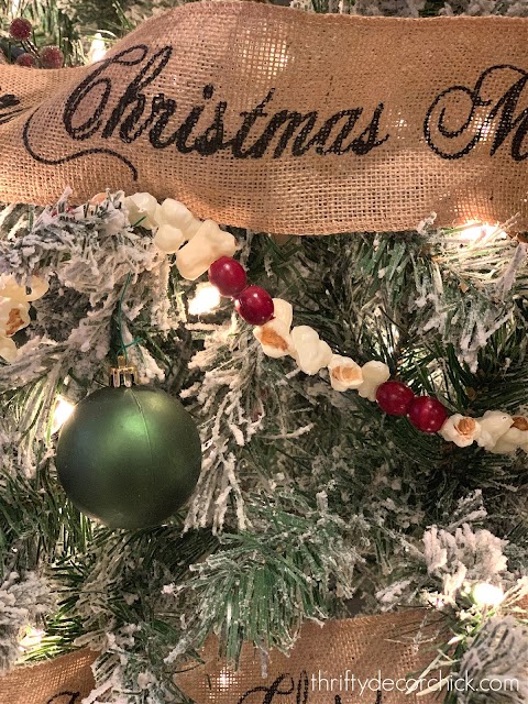 berry and popcorn garland on tree