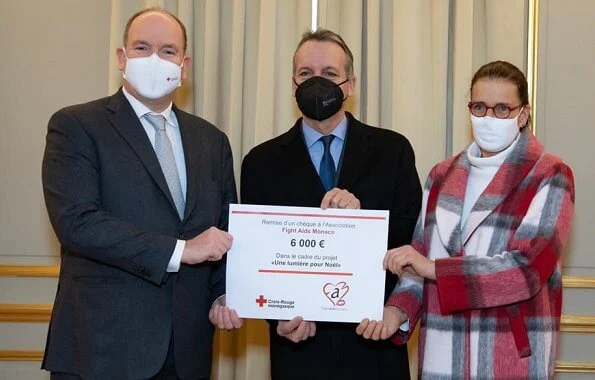 President of the Monaco Red Cross Prince Albert presented a check to Princess Stephanie