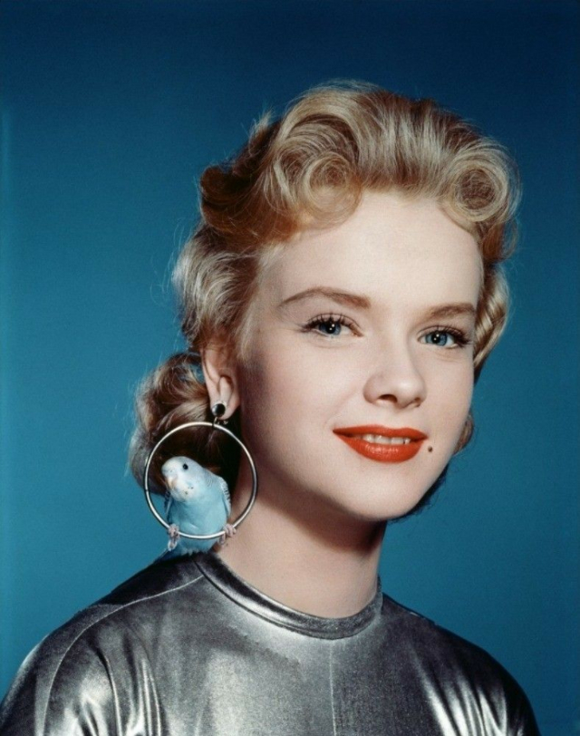 Anne Francis Wearing Aviary Earrings With Real Budgies in ‘Forbidden