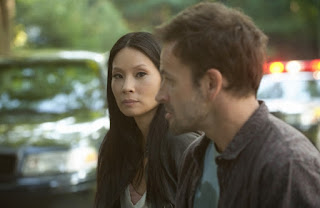 Jonny Lee Miller as Sherlock Holmes and Lucy Liu as Joan Watson in Elementary Episode # 4 "The Rat Race"
