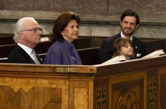 Queen Silvia wore a purple dress and cape from Georg Et Arend. Prince Alexander, Erik Hellqvist, Marie Hellqvist and Lina Hellqvist