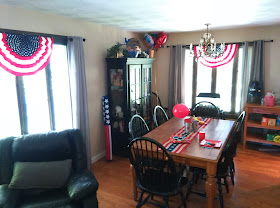 Americana dining room with red, white, and blue holiday party decorations.