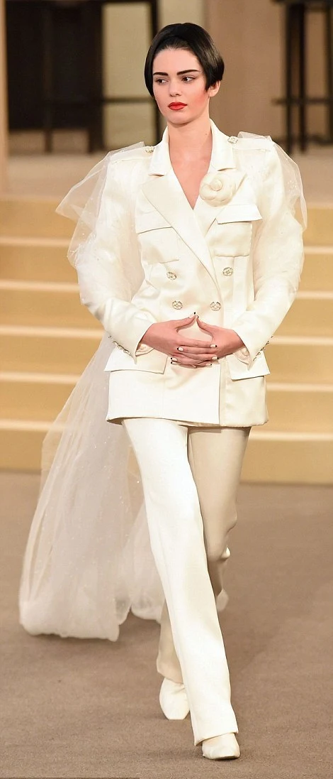 Kendall Jenner walks the Chanel Fall 2015 Paris Couture Show in a white ...