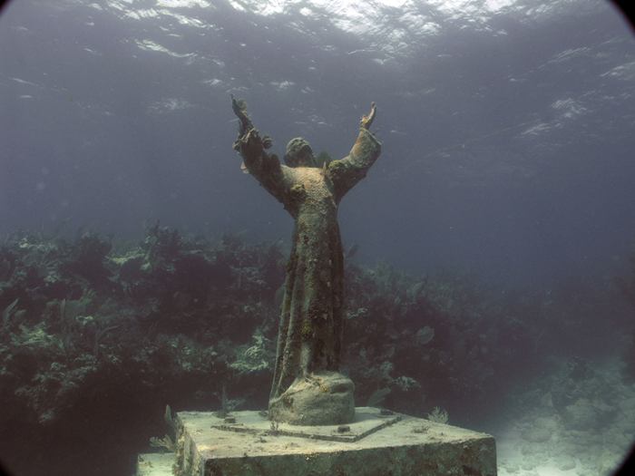 Christ of the Abyss is a submerged bronze statue of Jesus, of which the original is located in the Mediterranean Sea off San Fruttuoso between Camogli and Portofino on the Italian Riviera. It was placed in the water on 22 August 1954 at approximately 17 metres depth, and stands c. 2.5 metres tall. Various other casts of the statue are located in other places worldwide, both underwater and in churches and museums. The sculpture was created by Guido Galletti after an idea of Italian diver Duilio Marcante. The statue was placed near the spot where Dario Gonzatti, the first Italian to use SCUBA gear, died in 1947. It depicts Christ offering a blessing of peace, with his head and hands raised skyward.