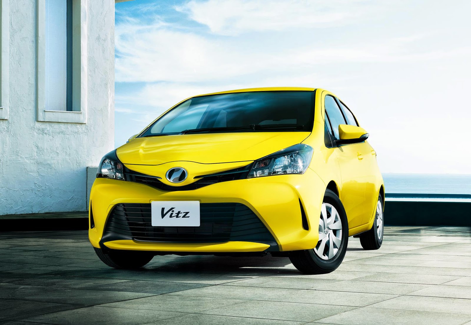 Yellow Toyota Vitz