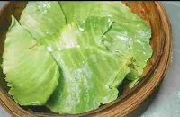 Cabbage leaves over momo basket