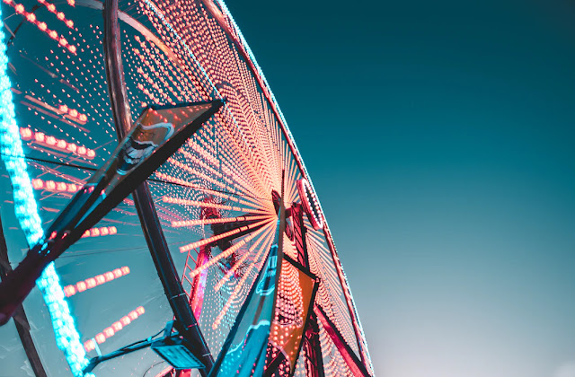 Worm's eyes view of a lit Ferris Wheel