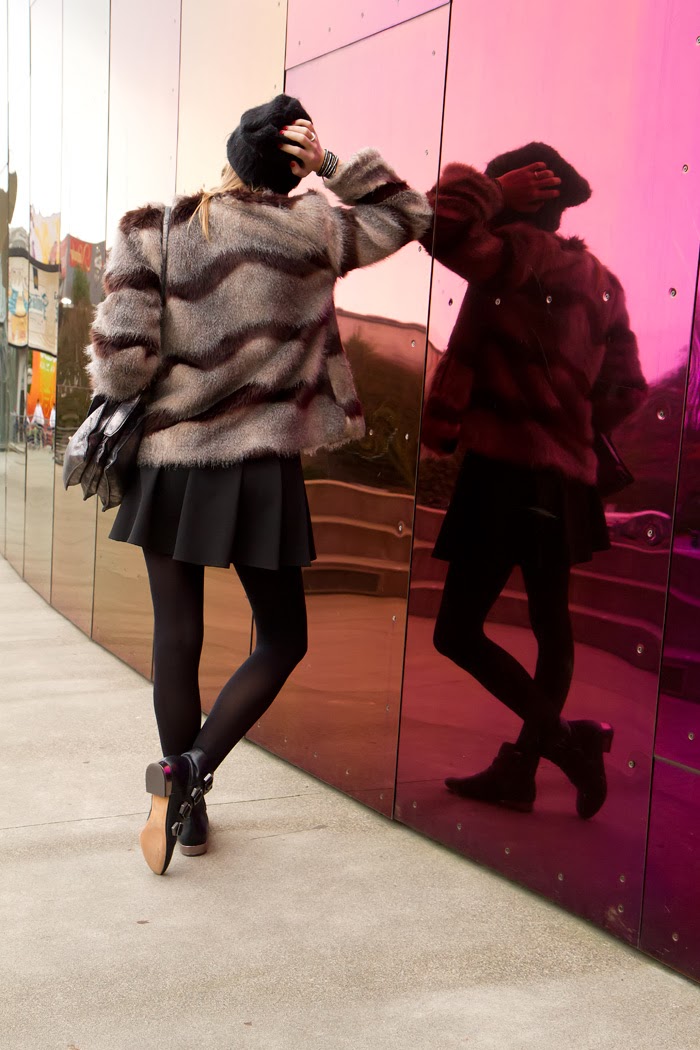 Vancouver Fashion Blogger, Alison Hutchinson, is wearing a striped faux fur coat from Nordstrom, an In Love With Fashion black dress, sam edelman buckle boots, a silver botkier bag and a slouchy beanie.
