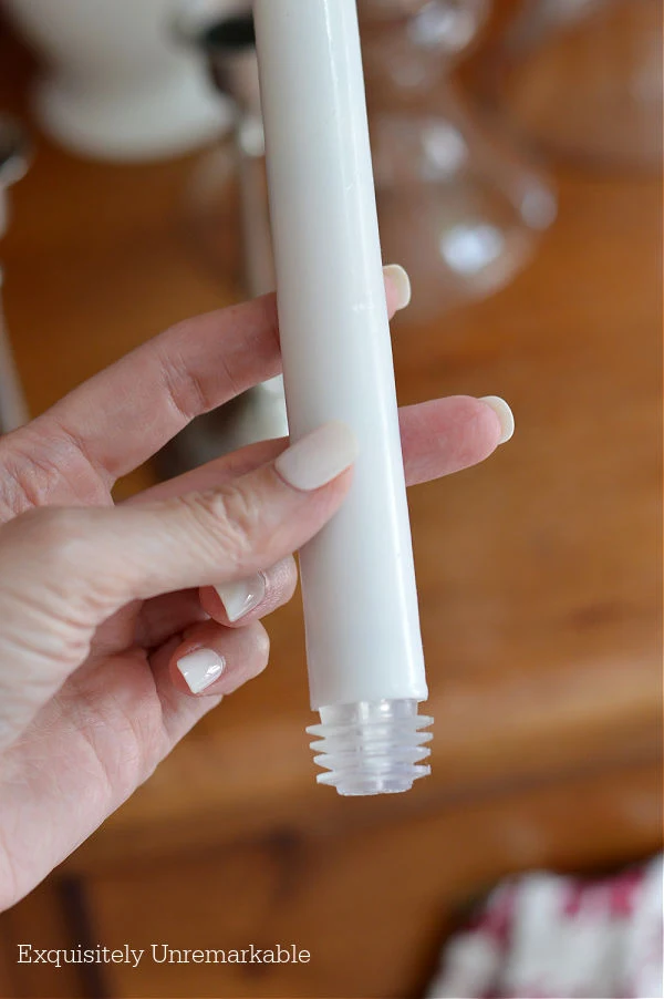 Electric taper candle in hand