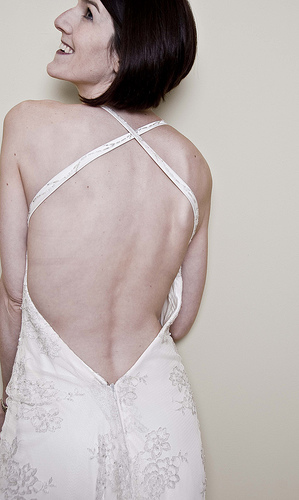 A backless wedding dress is clean and smooth lines