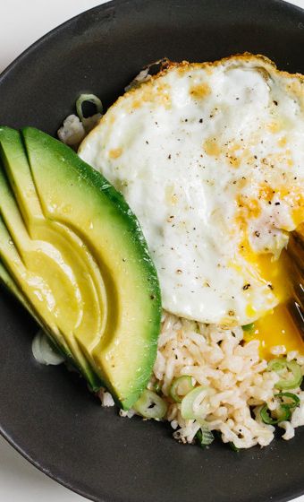 Brown rice—higher in fiber and other nutrients than its white counterpart—is the perfect vehicle for this quick, protein-heavy lunch.