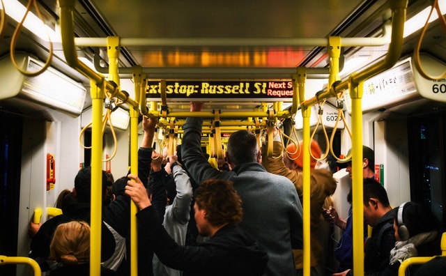 scrolling led sign inside a crowded bus