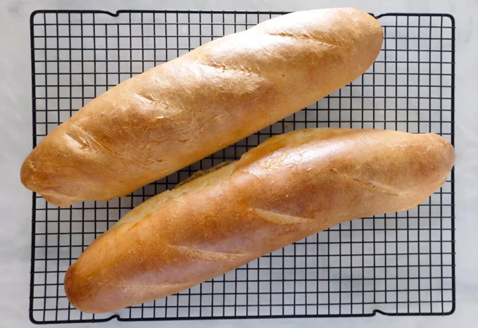 French bread on cooling rack