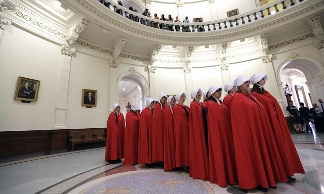 Activists dressed as characters from The Handmaid’s Tale