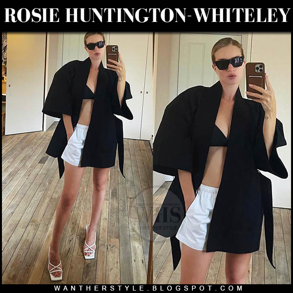 Rosie Huntington-Whiteley in black jacket and white shorts on