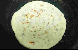 Cooking Cooking onion kulcha on tawa or pan