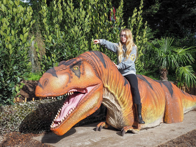 girl riding t-rex