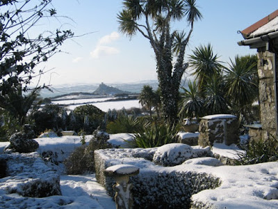 View over formal garden to st Michael's Mount in the snow