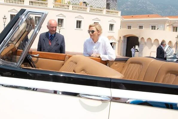 Princess Charlene wore Akris Punto striped flared skirt and white shirt. Prince's Palace of Monaco classical car event