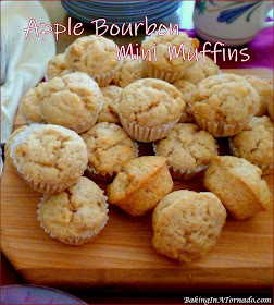 Apple Bourbon Mini Muffins are juice and apple bourbon flavored pop in your mouth bites studded with fresh apple and chopped walnuts. | Recipe developed by www.BakingInATornado.com | #bake #apple