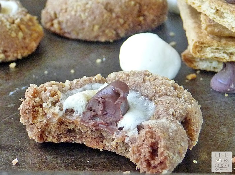 S'more Cookie Recipe | by Life Tastes Good | Fun chocolate cookies rolled in graham cracker crumbs and topped with a mini marshmallow. All the flavors of a traditional s'more rolled into an easy-to-make cookie. No open fire required!