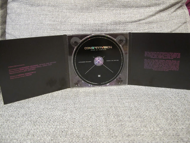 Photo of CD album cover opened for Conspiravision: Deus Ex Remixed