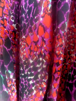 Print of my party dress with colours on red/orange, black, mauve and hints of white and green