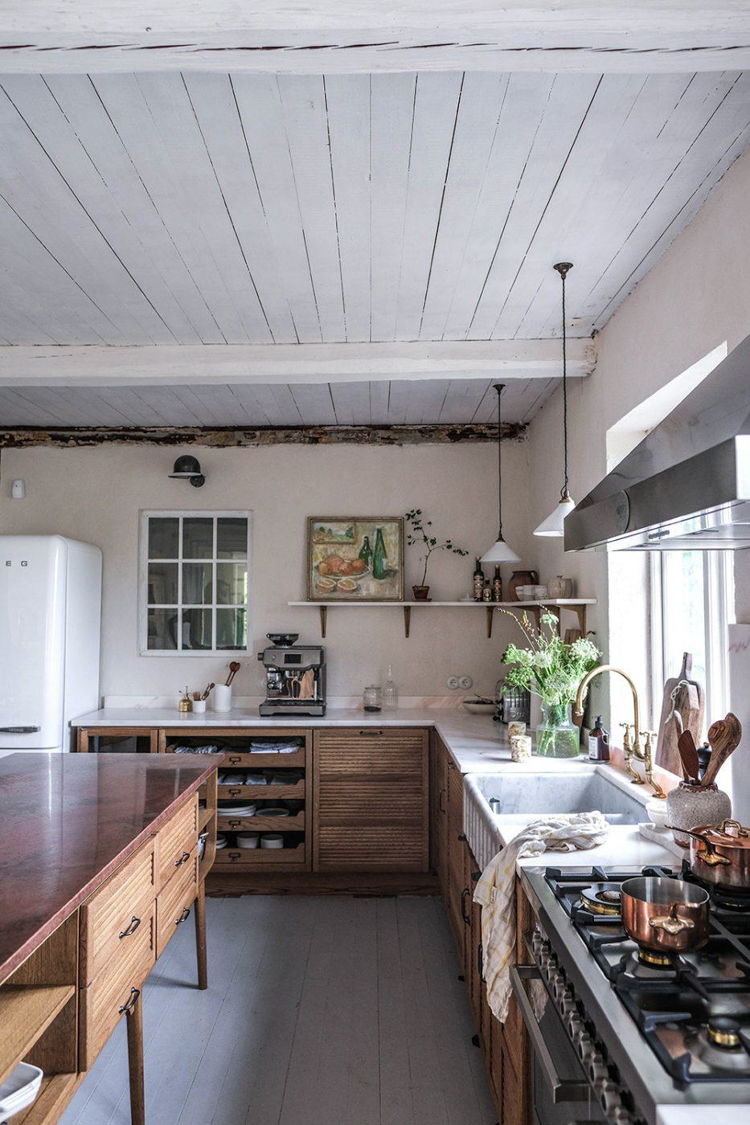 Oak and a Cosy Roaring Fire In A Swedish Cottage Kitchen