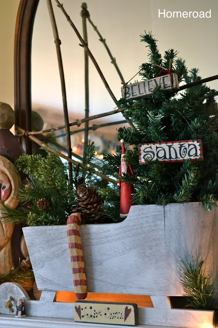 wooden sleigh on the mantel