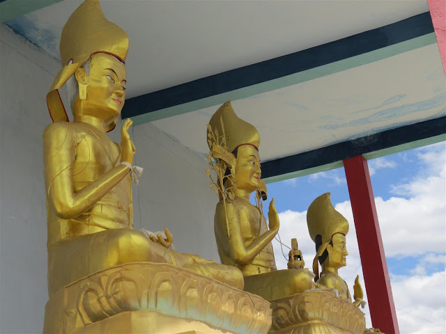 Three statues in Golden near Kye Monastery Three statues in Golden near Kye Monastery