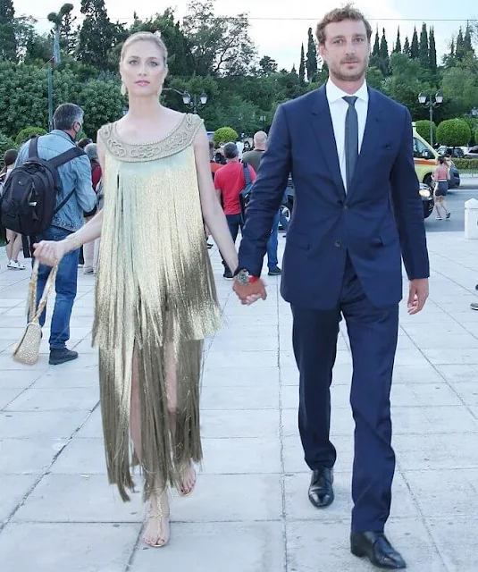 Beatrice Borromeo wore a golden fringed gown and headpiece from Christian Dior. Buccellati Milan earrings and bracelet