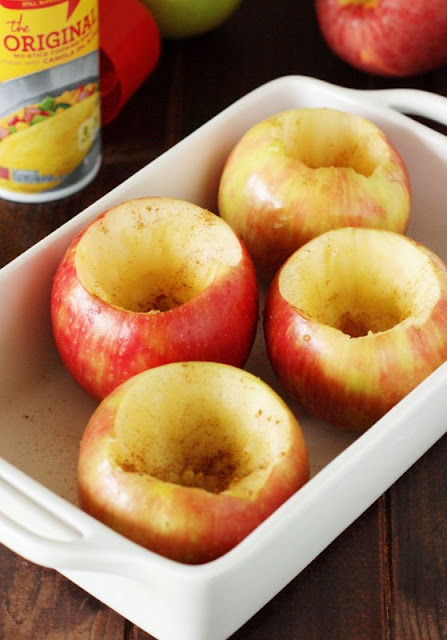 Cored Apples in Baking Dish to Make Honey-Baked Apples Image