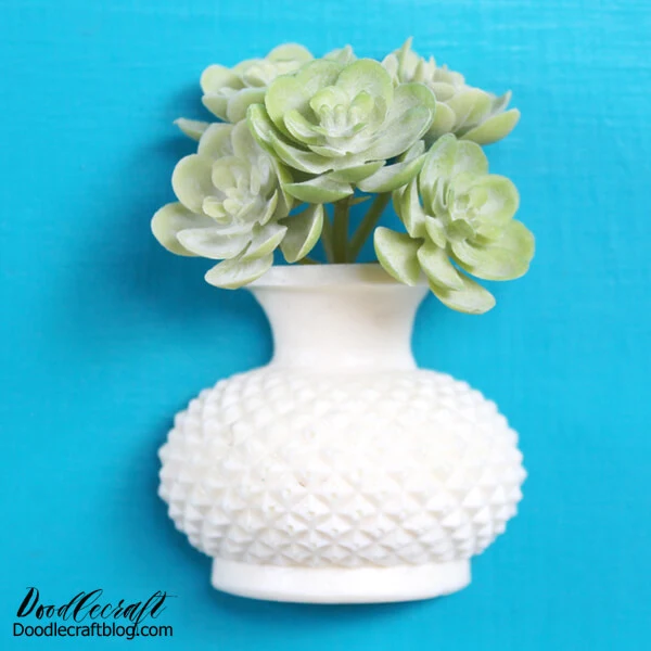 Make a cute succulent vase magnet with FastCast resin, a little faux succulent and a disc magnet, perfect for a fridge or locker ornament.  I love filling my fridge with wedding invitations, cards, kids artwork and more…most days my fridge looks completely cluttered.