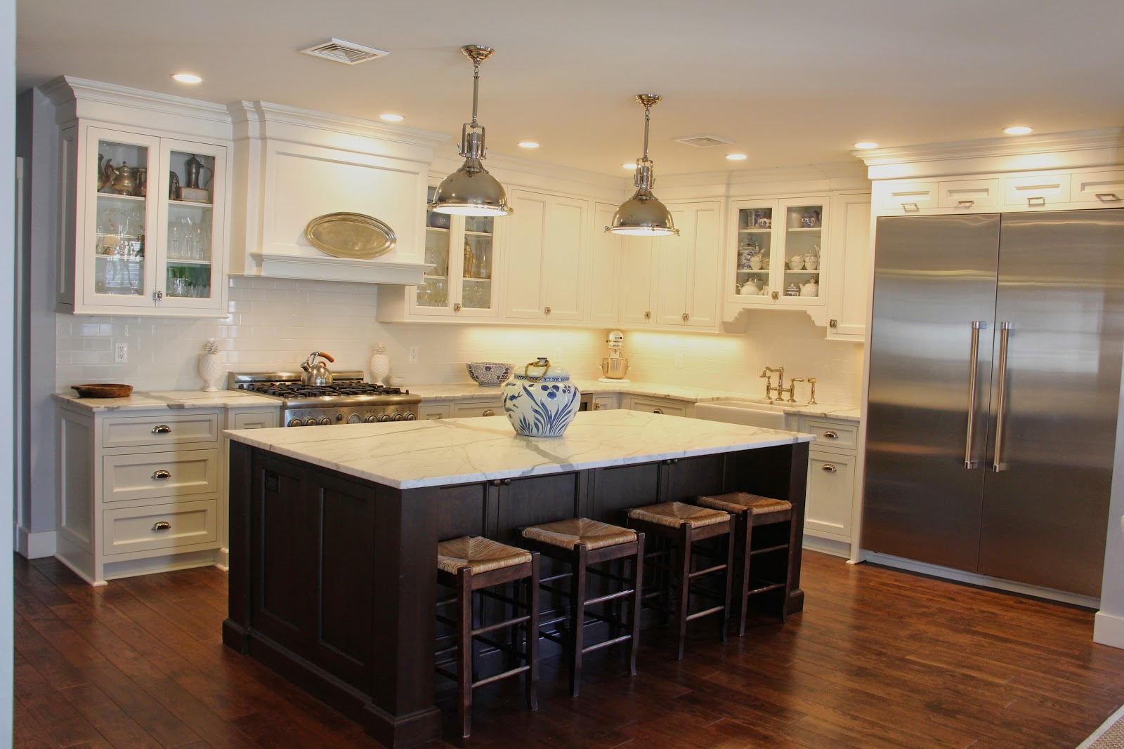 Picture of a lady in a flowy dress standing in front of a stunning view